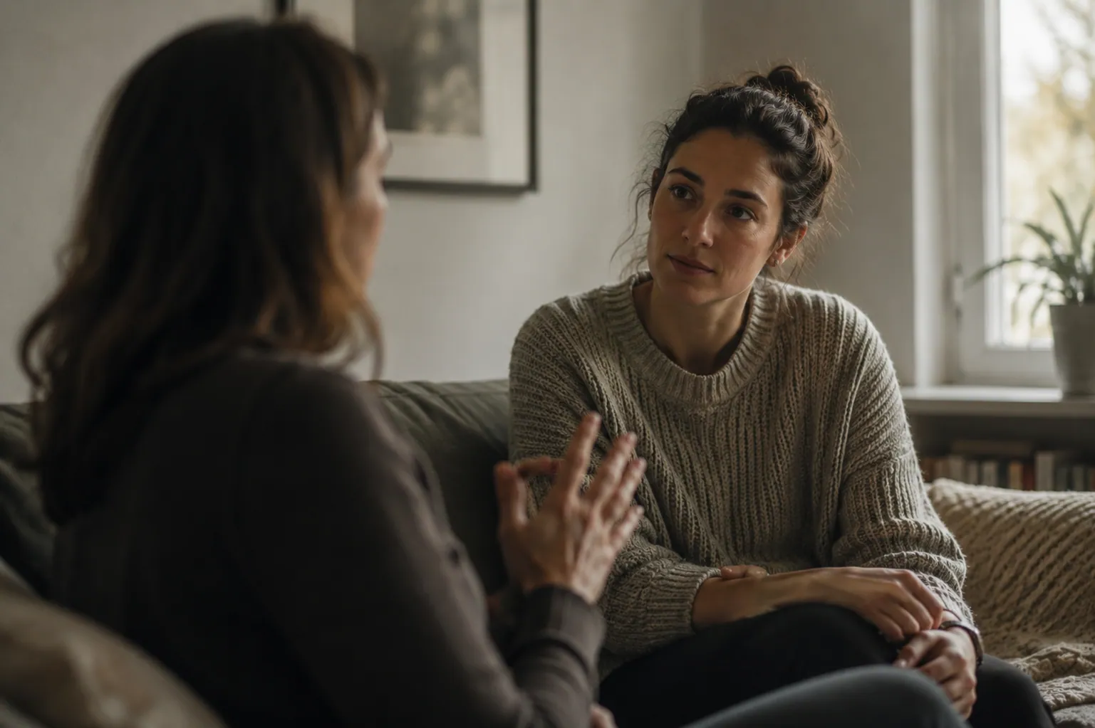 A woman listening closely during a supportive conversation